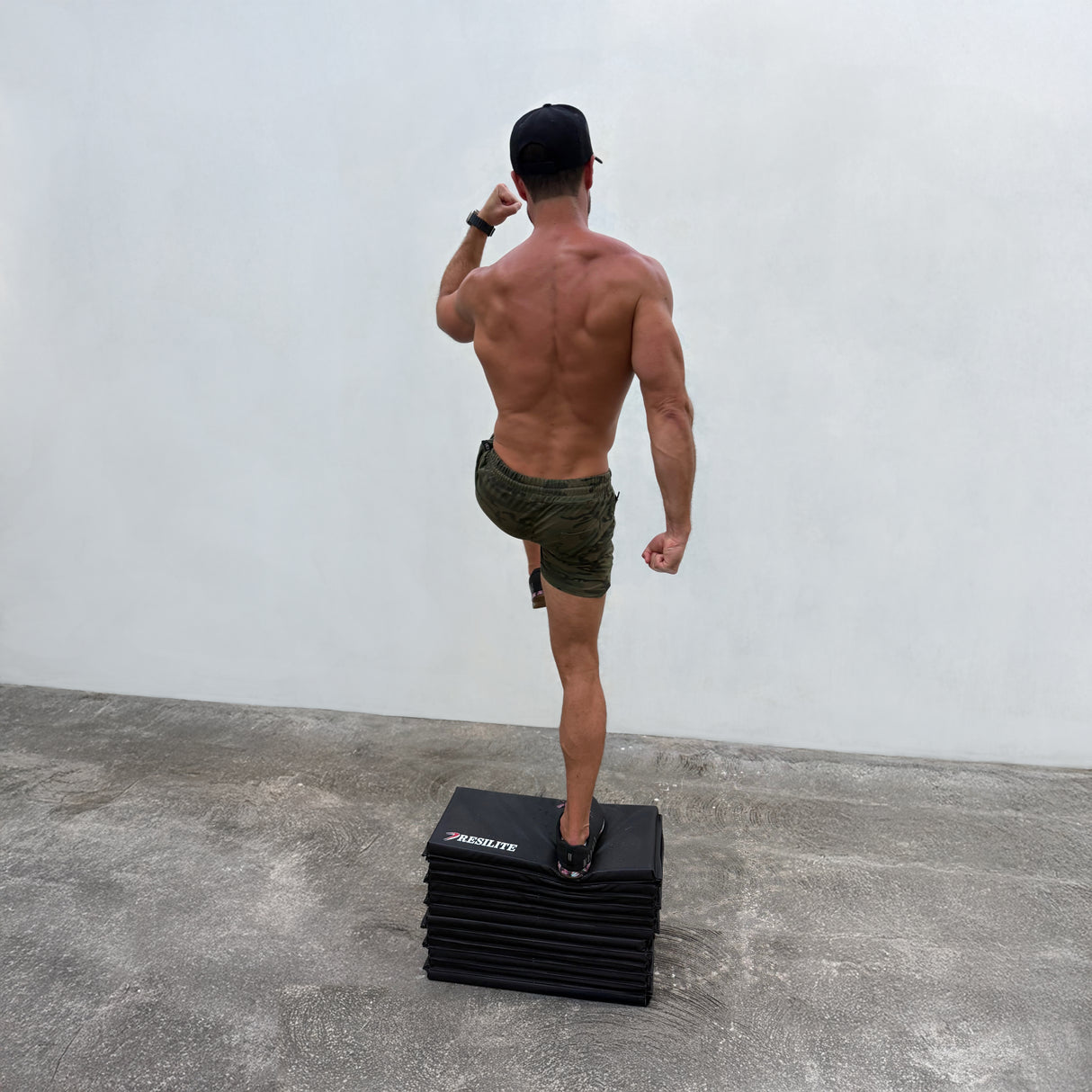 Step-up exercise demonstrated on a premium Resilite OmniMat.