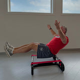 Man performing balance training exercise on The Slack Liner core stability trainer