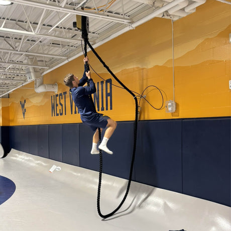 wrestler at West Virginia University using battle rope for conditioning and strength training